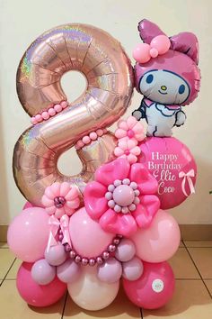 hello kitty balloon bouquet with helium balloons and an 8 number balloon in the shape of a flower