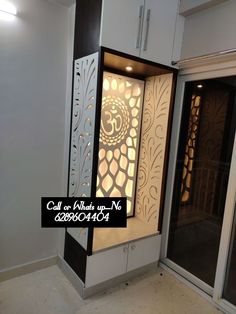 the inside of a room with an open door and decorative glass panels on the wall