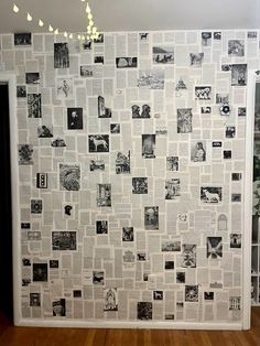 a room with a wall covered in newspaper paper