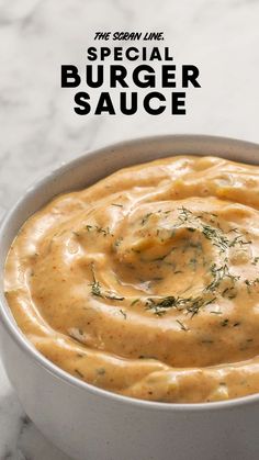 a white bowl filled with sauce on top of a table