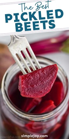 pickled beets in a jar with a fork