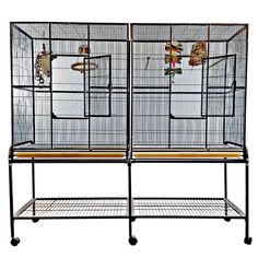 two metal cages with cats in them on wheels