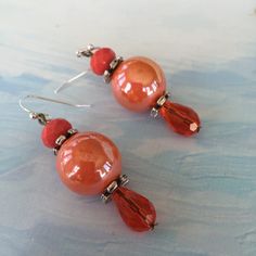 Coral Earrings  Citrus Orange Earrings  Spring by OBXBluePelican Beachy Jewelry, Easter Jewelry, Spring Earrings, Orange Earrings, Spring Jewelry, Coral Earrings, High Energy, Pantone Color, Pearl Earrings