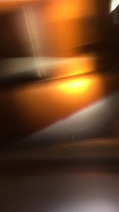 blurry photograph of an orange and white object