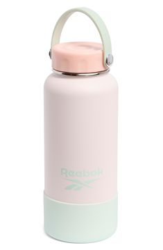 the reebok water bottle is pink and white with a light green handle on it