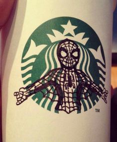 a starbucks cup with a spider man drawn on it