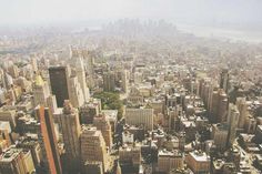 an aerial view of a city with tall buildings