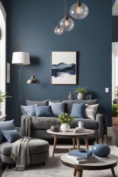 a living room with blue walls and grey furniture in the center, surrounded by potted plants