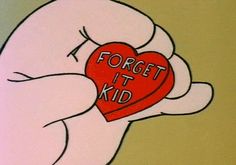 a hand holding a red heart with the words forget it kid written on its side