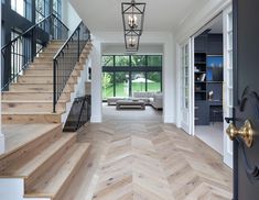 the interior of a house with wood floors and white walls is featured on instagram