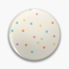 a white plate with multicolored dots on it