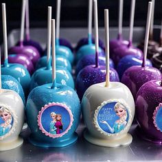 there are many candy apples that have frozen princess pictures on them