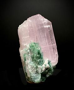 Beautiful pink color kunzite crystal with green tourmaline, from Alingar Pegmatite Field, Laghman, Afghanistan. Size: 55 x 27 x 20 mm. 58 grams Fluorescence with 365nm long wave UV. Kunzite is a pink to violet variety of the mineral spodumene, named after the gemologist George Frederick Kunz who first identified it in 1902. It is a stone of emotion that connects the heart and the mind, and stimulates a healing communion between the two. Kunzite has a glassy transparency and forms in flattened pr Laghman Afghanistan, Green Tourmaline Crystal, Kunzite Crystal, Pink Kunzite, Rough Gems, Cool Rocks, Calcite Crystal, Tourmaline Crystal, Purple Stones