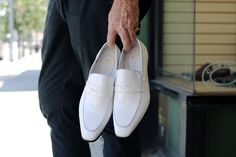 Elegant Fitted Slip-on Moccasins, Modern White Slip-ons For Work, White Closed Toe Slip-ons For Office, White Pointed Toe Slip-ons For Work, Fitted White Leather Shoes With Almond Toe, White Fitted Leather Shoes With Almond Toe, White Leather Slip-ons For Office, Elegant White Slip-ons For Office, White Fitted Leather Shoes For Spring