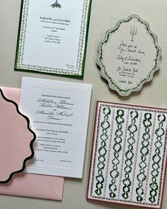 the wedding stationery is laid out on top of each other