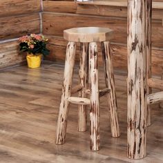 two wooden stools sitting next to each other