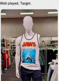 a mannequin wearing a tank top that says, well played target jawss