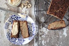 slices of cake sitting on top of a blue and white plate next to a wire rack