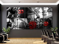 a gym with red dumbs and black and white pictures