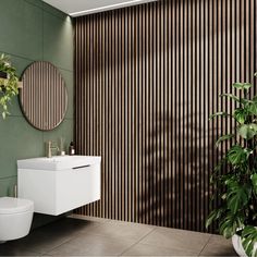 a modern bathroom with green walls and wood slats