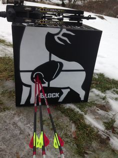 some skis are laying on the ground in front of a black and white box