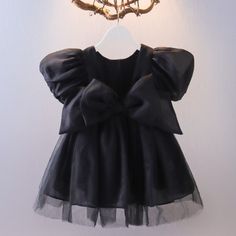 Every Toddler Needs A Little Black Dress . . .Right? This Dress Is So Simple But Yet Perfect! It Features Sheer Puffy Sleeves, 2 Layers Of Tulle And A Black Slip For Coverage. It Has A Scoop Back Design And An Attached Bow! Toddler Black Dress, Princess Dresses Kids, Toddler Birthday Dress, Tulle Skirts Outfit, Pleated Skirt Set, Ruffles Top, Tutu Birthday, Black Toddler, Solid Color Dress