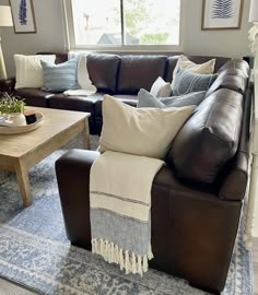 a living room filled with furniture and pillows