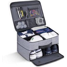 an open suitcase with shoes and other items in the bottom compartment, on a white background