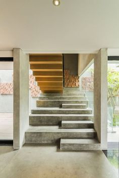 the stairs are made out of concrete and wood