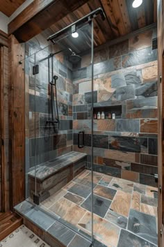 a walk in shower sitting inside of a bathroom next to a wooden wall and floor