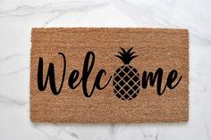 a welcome mat with a pineapple on it