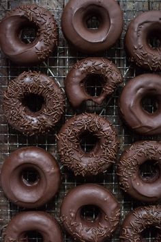 chocolate donuts on a cooling rack ready to be eaten