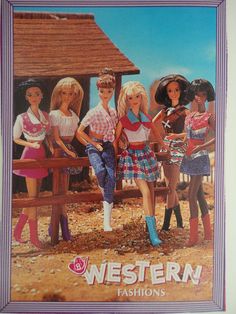 a group of dolls standing next to each other in front of a wooden fence and building