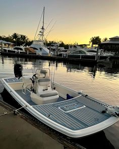 a small boat is docked in the water