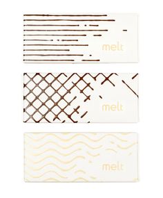 three white and brown business cards with the words melt on them in gold foil lettering