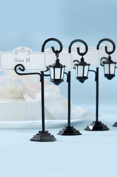 four black and white wedding place cards holders