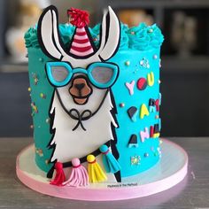 a birthday cake with an image of a llama wearing sunglasses and a party hat