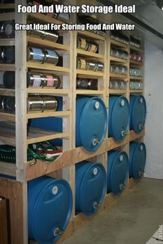 several blue barrels are lined up on the wall in a storage area with shelves holding various types of cans