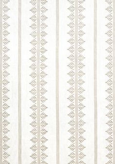 a white and beige striped wallpaper with an intricate design on the bottom half of it