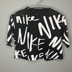 Brand New, Never Worn. In Excellent Condition. This Playful Crop Top Features “Nike” Written Over It In Various Fonts. Boxy And Cropped Fit. Size: S Make Me An Offer! Sporty Logo Print Cropped T-shirt For Spring, Sporty Cropped Top With Logo Print, Casual Black Cropped T-shirt With Graphic Print, Black Cropped Top With Logo Print, Logo Print Cropped Shirt For Streetwear, Cropped Logo Print Shirt For Streetwear, Black Logo Print Crop Top T-shirt, Black Logo Print Crop Top For Streetwear, Cropped Logo Print Tops For Streetwear