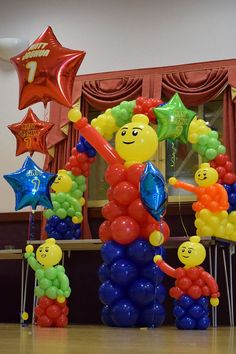 balloons are arranged in the shape of people and stars