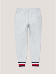 Tommy Hilfiger women’s pant. Whether on the go or simply relaxing the day away, our latest sweatpant is sure to become a wardrobe favorite thanks to the soft cotton knit and comfortable, elastic waist. Matching fleece top available. Part of our Adaptive Collection, designed for ease of dressing in classic Tommy style.  Material: 100% Cotton. Cotton Sportswear Sweats For Loungewear, Cotton Joggers For Loungewear Sportswear, Cotton Sweatpants With Ribbed Cuffs For Loungewear, Cotton Sweats With Elastic Cuffs For Lounging, Comfy Cotton Sweats For Loungewear, Cotton Sweatpants For Lounging, Casual Cotton Sweats With Ribbed Cuffs, Casual Tapered Leg Sweats For Loungewear, Cozy Fit Sweatpants With Ribbed Cuffs For Loungewear