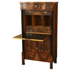 an old fashioned wooden cabinet with drawers