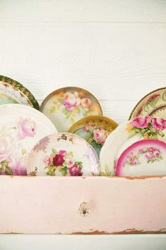 a pink box filled with lots of plates