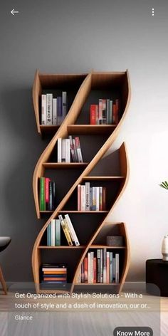 a book shelf with books on it next to a chair