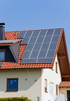 solar panels on the roof of a house - stock photo - images