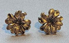 "Vintage 1940s era fine Sterling Silver flower earrings. Earrings are nicely detailed and are screw back style. Earrings are fully hallmarked and will arrive gift boxed. HALLMARKS BGE, 925. MEASUREMENTS 1/2\" across. WEIGHT 3.93 GRAMS. MATERIALS Sterling Silver." Vintage Nickel-free Clip-on Earrings For Formal Occasions, Vintage Flower-shaped Pierced Jewelry, Vintage Silver Flower-shaped Earrings, Vintage Silver Screw Back Earrings, Vintage Flower-shaped Pierced Earrings, Vintage Flower Earrings, Vintage Silver Pierced Flower Earrings, Vintage Silver Flower Earrings Pierced, Vintage Nickel-free Flower Earrings