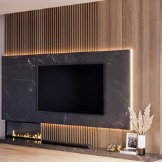 a flat screen tv mounted to the side of a wall next to a fire place