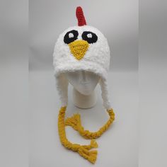 "Perfect for the chicken lover in your life Hat is made to order in any size. It's made with a combination on acrylic white yarn and Berna Pipsqueak yarn, giving it a super soft feel. Buttons are used for the eyes and may vary depending on my stock. Customizations are welcome...different comb, tassels, etc. Please make a \"Note to Seller\" about your preferences Don't forget to add Chicken Feet Covers to complete your Chicken Halloween Costumes https://www.etsy.com/listing/744100147/crochet-chic Whimsical White Cap Hats, White Novelty Halloween Costume Hats And Headpieces, White Novelty Halloween Costume Hat, White Halloween Cap, Fun White Cap Style Costume Hats And Headpieces, Fun White Cap Style Costume Hats, Fun White Costume Hats And Headpieces, Fun White Costume Cap, White Adjustable Halloween Costume Hats And Headpieces