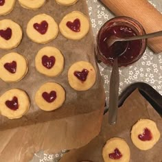 cookies with hearts on them and jam in the middle, ready to be cut into pieces